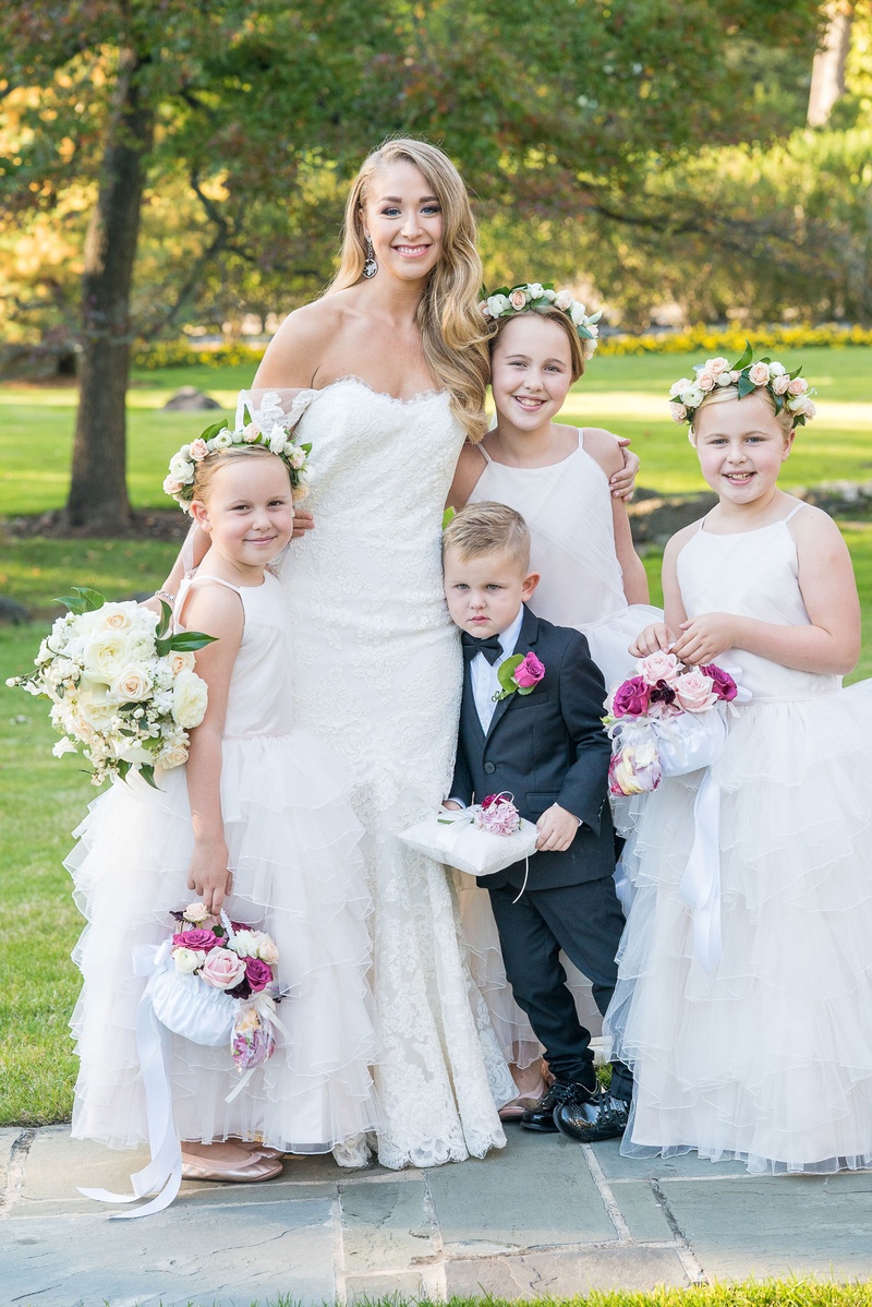 Flower Girls in Ruffle Skirts %26 Crowns
Photography: Robert Evans for 5th Avenue Digital
Read More:
http://www.insideweddings.com/weddings/outdoor-jewish-wedding-ceremony-at-stunning-chateau-in-new-jersey/1058/ Bride in off shoulder anne barge wedding dress with ring bearer pillow and three flower girls