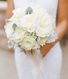 Ivory Bridal Bouquet
Photography: Marisa Holmes
Read More:
http://www.insideweddings.com/weddings/seafoam-ivory-hued-oceanfront-wedding-in-laguna-beach-california/431/ Bride holding dusty miller and white florals