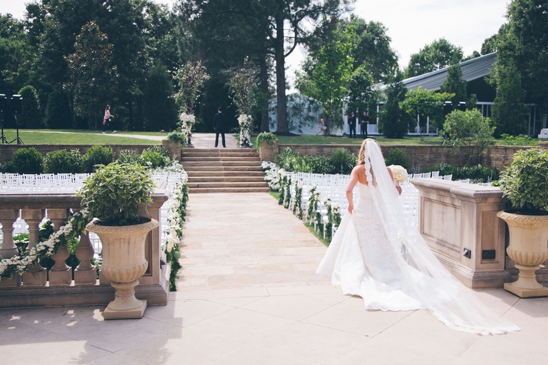 Cathedral-Length Veil
Photography: David %26 Tammy Molnar
Read More:
http://www.insideweddings.com/weddings/an-exquisite-backyard-wedding-in-tennessee/532/ Bride walking through chairs to meet groom