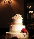 Wedding Cake
Photography: Lena Hyde Photography
Read More:
http://www.insideweddings.com/weddings/lavender-burgundy-spring-wedding-at-golf-club-in-florida/142/ White wedding cake with green bands and red flowers