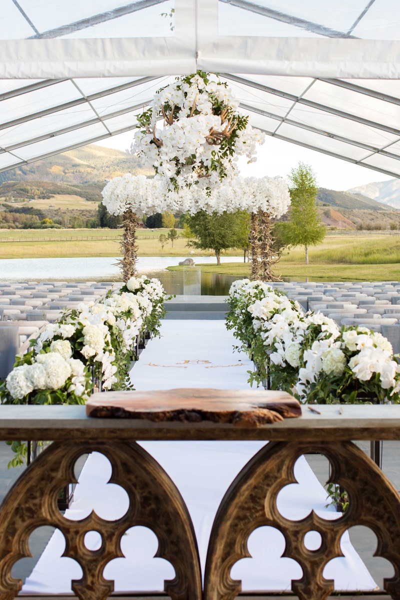 Church-Inspired Guest Book Table
Photography: Perez Photography
Read More:
http://www.insideweddings.com/weddings/incredible-tented-ceremony-barn-reception-at-ranch-in-aspen/860/ Outdoor tent wedding Aspen Colorado ranch with wood slab on church table for guest book display