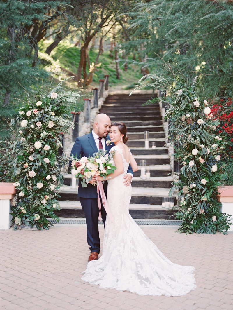 Jordan Bagsic %26 Kimbal Leonardo
Photography: Anya Kernes Photography
Read More:
http://www.insideweddings.com/weddings/outdoor-wedding-with-dusty-rose-powder-blue-lavender-palette/1288/ wedding portrait bride and groom outdoors loose bouquet navy blue suit brown dress shoes