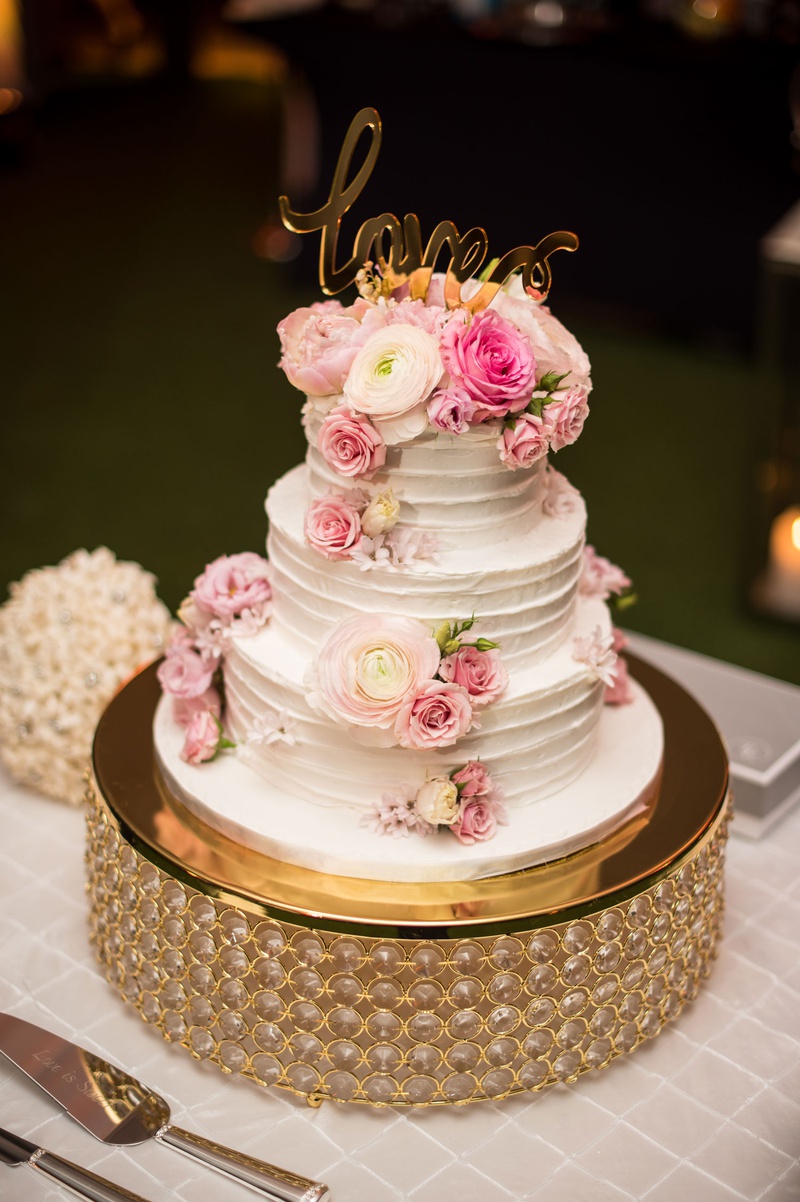 Cake with Fresh Pink Flowers %26 Gold Topper
Photography: Suzanne Delawar Studios
Read More:
http://www.insideweddings.com/weddings/intimate-oceanfront-wedding-with-romantic-red-pink-white-palette/1235/ wedding cake three layers fresh ranunculus rose flowers with gold love calligraphy cake topper