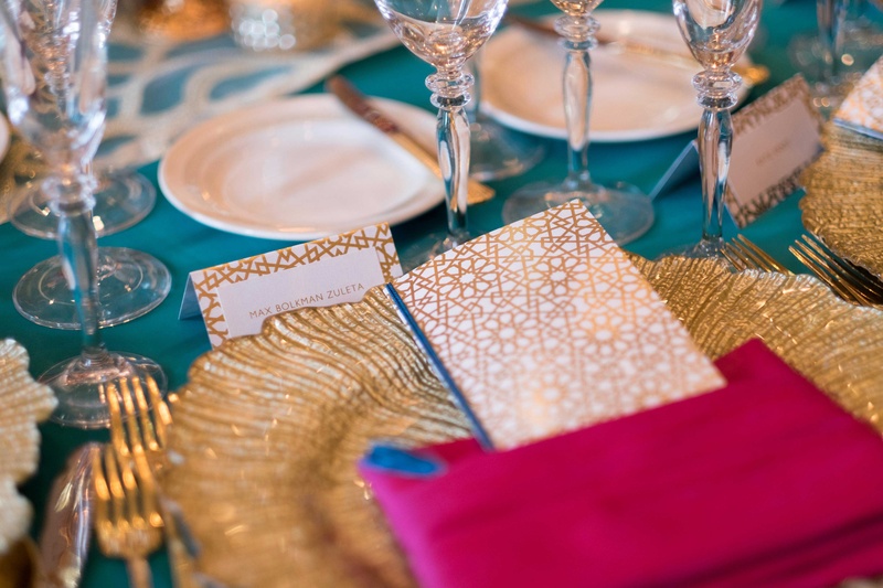 Place Setting with Vibrant Color Palette
Photography: Collin Pierson Photography
Read More:
http://www.insideweddings.com/weddings/bold-and-bright-wedding-styled-shoot-inspired-by-marrakesh-morocco/825/ turquoise gold pink tablescape at place setting leafed charger plate with geometric menus