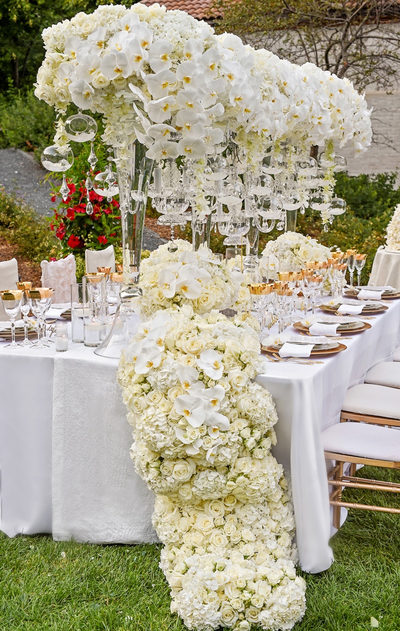 Cascading Floral Runner
Photography: Carasco Photography
Read More:
http://www.insideweddings.com/weddings/styled-shoot-combines-old-world-charm-and-contemporary-fashion/849/ towering centerpieces with orchids and glass orbs, floral table runner