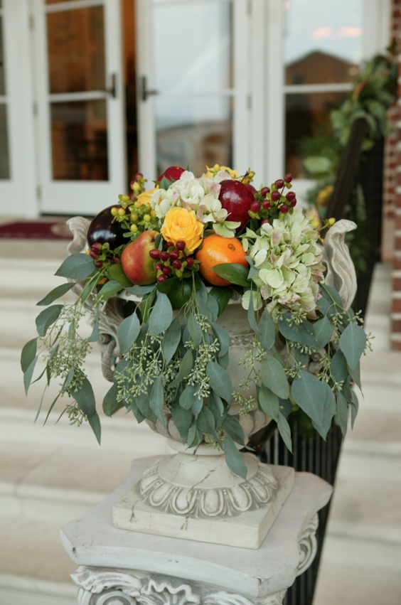 Fall Fruit and Flower Arrangement
Photography: Mark Staff Photography
Read More:
http://www.insideweddings.com/weddings/autumn-inspired-golf-club-wedding-in-south-carolina/149/ Church entrance flower and fruit wedding flowers