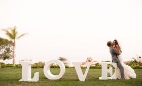 Love Sign Couple
Photography: Studio EMP
Read More:
http://www.insideweddings.com/weddings/oceanfront-santa-barbara-wedding-with-romantic-color-palette/463/ Southern California bride and groom next to LOVE letters