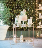 Wedding Cakes on Bar Cart
Photography: Ether %26 Smith
Read More:
http://www.insideweddings.com/weddings/organic-glam-vintage-inspired-real-wedding-in-california/1180/ wedding cakes on pedestal bar cart champagne hedge wall string lights