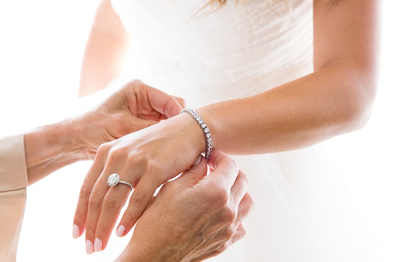 Bride with Tennis Bracelet
Photography: Duke Photography
Read More:
http://www.insideweddings.com/weddings/jewish-ceremony-classic-ballroom-reception-in-beverly-hills/922/ mother of the bride puts diamond tennis bracelet on bride