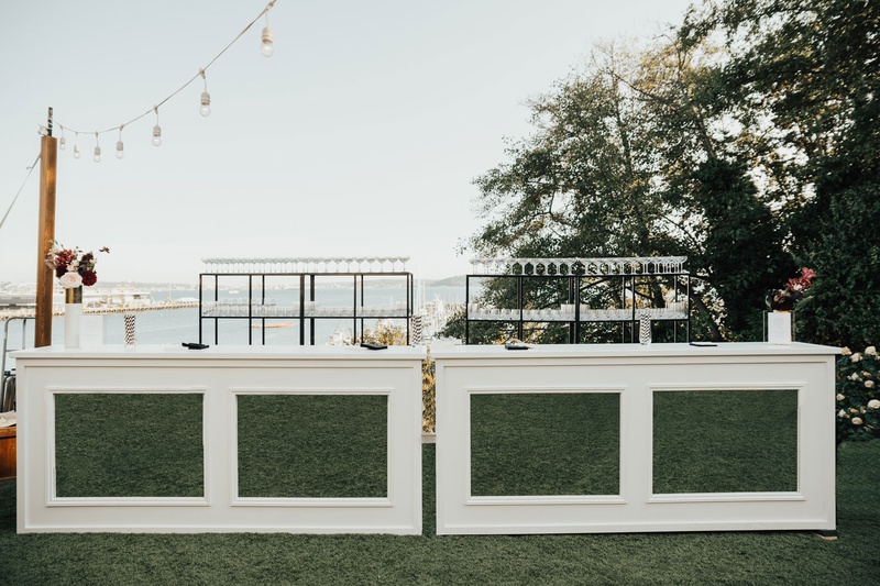 Wedding Bar with View of Seattle
Photography: Sam %26 Sola Lee Photography
Read More:
http://www.insideweddings.com/weddings/modern-outdoor-ceremony-tent-reception-in-seattle-on-puget-sound/1309/ outdoor wedding reception cocktail hour white mirror hedge bar greenery shelving string bistro light