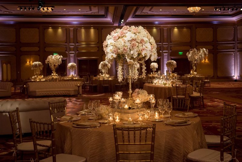 Blush %26 Ivory Reception at Grand Del Mar
Photography: Boyd Harris Photographs
Read More:
http://www.insideweddings.com/weddings/a-jeweled-floral-wedding-at-fairmont-grand-del-mar-in-san-diego/745/ Wedding reception tables with flower and jewel centerpieces featuring orchids and roses