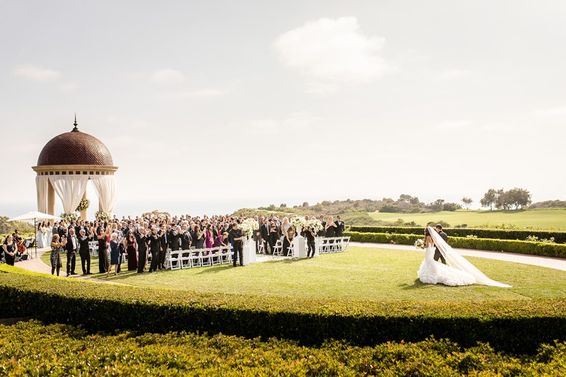 Bride Approaching Ceremony
Photography: Chard Photo
Read More:
http://www.insideweddings.com/weddings/alfresco-ceremony-on-the-coast-classic-ballroom-reception/1290/ the resort at pelican hill wedding under a rotunda, bride walking to the aisle