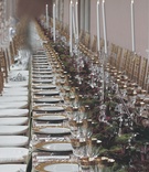 Reception Table Decor
Photography: Imely Photography
Read More:
http://www.insideweddings.com/weddings/jewish-wedding-at-the-john-and-mable-ringling-museum-of-art/174/ Long reception table topped with gold rimmed china and glassware, runner of flowers, and candelabra