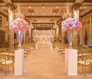 Aisle Framed by Pink and White Rose Centerpieces