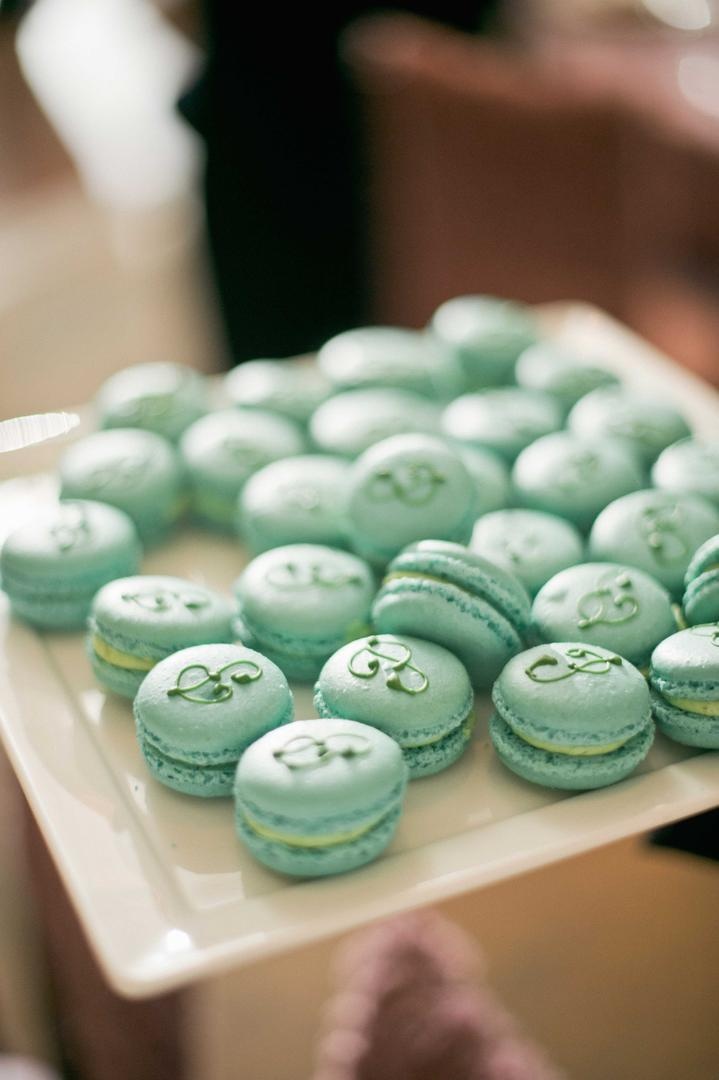 French Macarons
Photography: Harwell Photography
Read More:
http://www.insideweddings.com/weddings/romantic-woodland-inspired-atlanta-wedding-with-natural-details/433/ Blue-green French macaron cookies with initial P icing