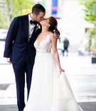 Bride in A-Line Gown Kissing Groom
Photography: Roey Yohai Photography
Read More:
http://www.insideweddings.com/weddings/elegant-jewish-wedding-at-architectural-landmark-in-new-york-city/1085/ Lace v-neck wedding dress a-line gown from kleinfeld bridal by rivini kissing groom holding train