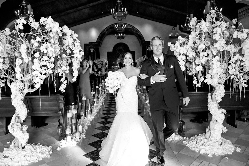 Bride and Groom Recessional at Chapel
Photography: Boyd Harris Photographs
Read More:
http://www.insideweddings.com/weddings/a-jeweled-floral-wedding-at-fairmont-grand-del-mar-in-san-diego/745/ bride and groom recessional with trees wrapped with orchids, dripping with jewels, as ceremony decor