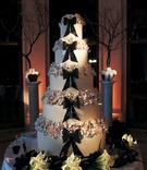 Sophisticated Wedding Cake
Photography: Artistic Weddings Photography
Read More:
http://www.insideweddings.com/weddings/celebrity-stylist-anya-sarres-incredible-san-francisco-wedding/223/ Black bow and sugar flowers on tall wedding cake