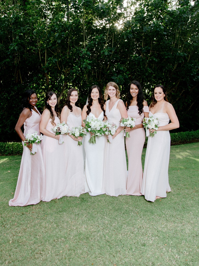 Bridesmaids in Pale Pink Mismatched Gowns
Photography: Chris J. Evans Photography
Read More:
http://www.insideweddings.com/weddings/outdoor-winter-ceremony-and-reception-on-the-big-island-in-hawaii/1306/ bride in crepe wedding dress with bridesmaids in light pink dresses of their choosing