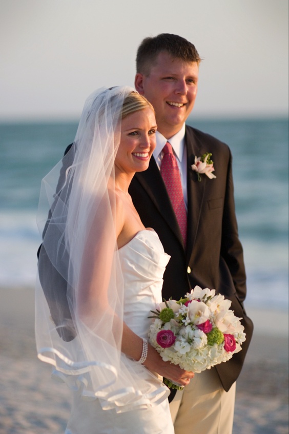 Beach Bride and Groom
Photography: Mermin + Christie Photographers
Read More:
http://www.insideweddings.com/weddings/tropical-theme-beach-wedding-in-naples-florida/184/ bride carrying bouquet stands with groom on beach