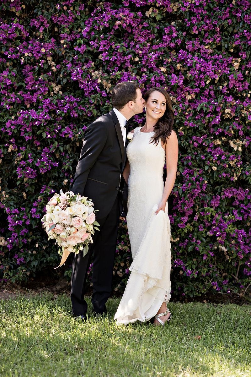 Groom Going to Kiss Bride on Cheek
Photography: Laurie Bailey Photography
Read More:
http://www.insideweddings.com/weddings/oceanfront-wedding-ceremony-classic-romantic-ballroom-reception/854/ groom going to kiss bride cheek black tuxedo white sheath gown pastel bouquet