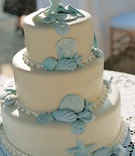 Seashell Wedding Cake
Photography: Suzanne Karp Photography
Read More:
http://www.insideweddings.com/weddings/seaside-wedding-in-california-with-beach-themed-decor/45/ Beach wedding cake with blue seashell decorations