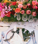 Palm Leaf Under Clear Charger Plate
Photography: Bryan Miller Photography
Read More:
http://www.insideweddings.com/weddings/church-ceremony-tropical-outdoor-reception-in-san-diego/1192/ wedding reception tropical place setting protea rose orchid centerpiece palm under ribbon
