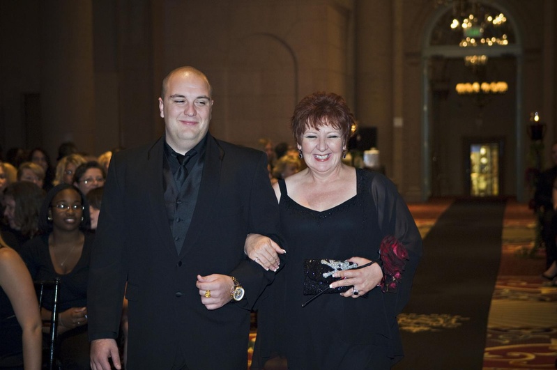 Loved Ones
Photography: Barnet Photography
Read More:
http://www.insideweddings.com/weddings/ashley-reeves-and-brandon-saller/261/ Lady in a black dress and wrap is escorted down the aisle by a man in a black tuxedo