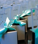 Miniature Chair Wedding Favors
Photography: Shawna Herring Photography
Read More:
http://www.insideweddings.com/weddings/chic-tiffany-blue-atlanta-celebration-with-4-foot-wedding-cake/245/ Tiffany blue box on top of mini white chair wedding favor