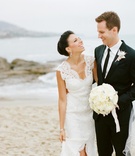 Couple on Sandy Beach
Photography: Marisa Holmes
Read More:
http://www.insideweddings.com/weddings/seafoam-ivory-hued-oceanfront-wedding-in-laguna-beach-california/431/ Bride and groom laughing while walking on beach