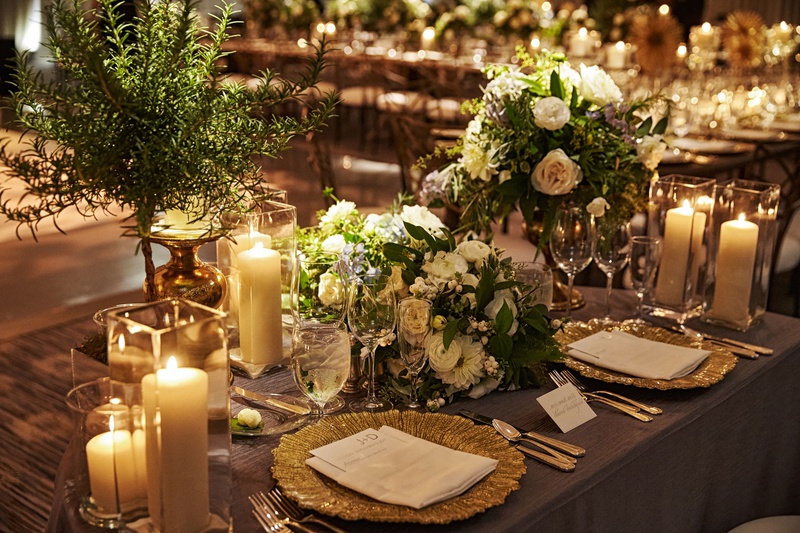 Place Settings at Chicago Sweetheart Table
Photography: KingenSmith
Read More:
http://www.insideweddings.com/weddings/modern-romantic-wedding-with-glam-geometric-details-in-chicago/1171/ wedding reception sweetheart table half circle table candles greenery gold charger plates