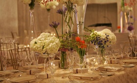 Modern Floral Centerpieces
Photography: Lyn Sims Photographer
Read More:
http://www.insideweddings.com/weddings/glamorous-fall-wedding-with-garden-touches-in-tucson-arizona/258/ Tall glass vases filled with colorful flowers