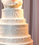 White Wedding Cake
Photography: Rob and Wynter
Read More:
http://www.insideweddings.com/weddings/a-pink-traditional-southern-wedding-at-a-civic-center-in-alabama/620/ White wedding cake with a lace design and fresh flowers