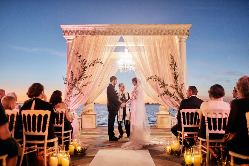 Ceremony After Sunset
Photography: Binaryflips Photography
Read More:
http://www.insideweddings.com/weddings/bayfront-ceremony-garden-courtyard-reception-in-sarasota-florida/1344/ ca' d'van outdoor wedding ceremony at night overlooking sarasota bay