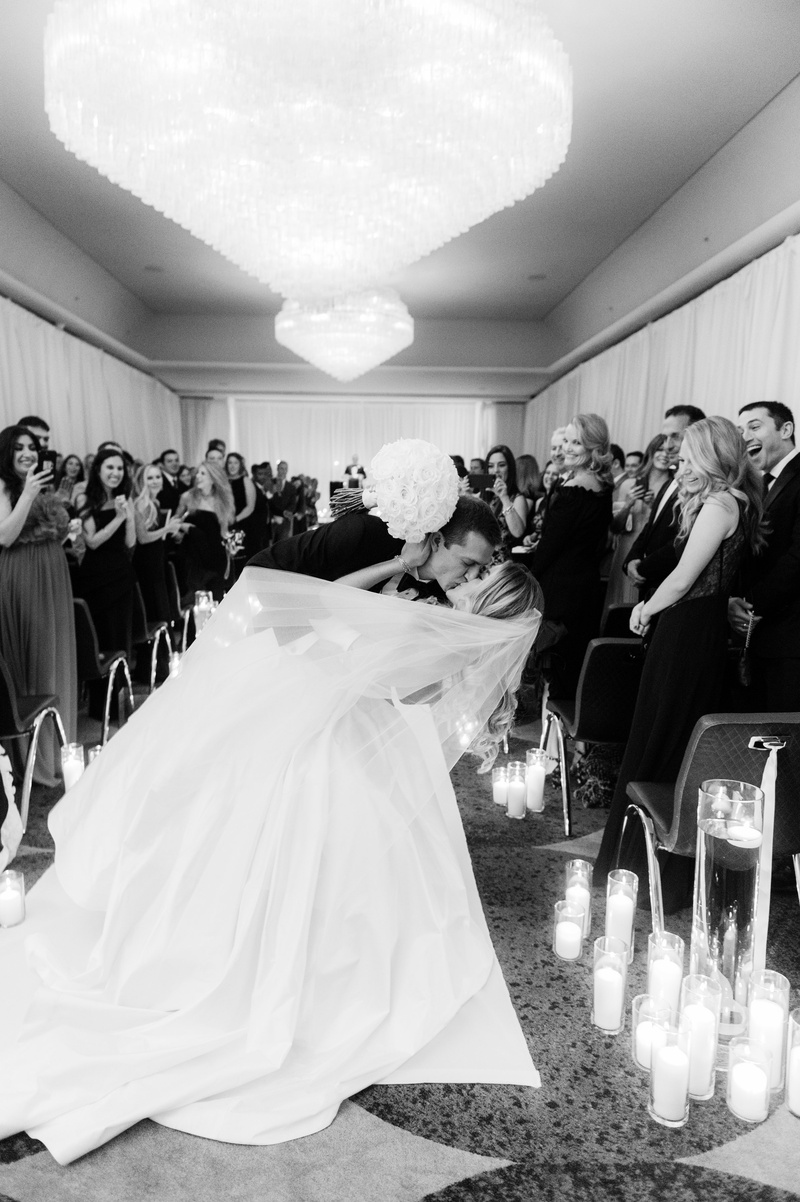 Dipped Kiss at the End of the Aisle
Photography: Abby Jiu Photography
Read More:
http://www.insideweddings.com/weddings/modern-wedding-with-a-black-and-white-palette-in-washington-dc/1236/ black and white photos of groom dipping bride for a kiss at the end of aisle