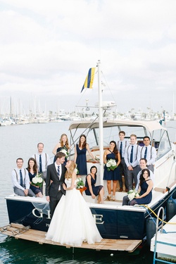 Photography: Luke %26 Katherine Griffin for Max %26 Friends
Read More:
http://www.insideweddings.com/inspiration/board/261/msimpson/stylish-getaway-vehicles/ Bride and groom with nautical blue wedding party on family boat in bay in San Diego