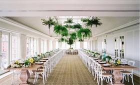 California-Inspired Reception Décor
Photography: Branco Prata
Read More:
http://www.insideweddings.com/weddings/chic-destination-wedding-with-california-style-in-washington-dc/1042/ Wedding reception sunlit ballroom two long wood tables ferns in macrame planters hanging ceiling