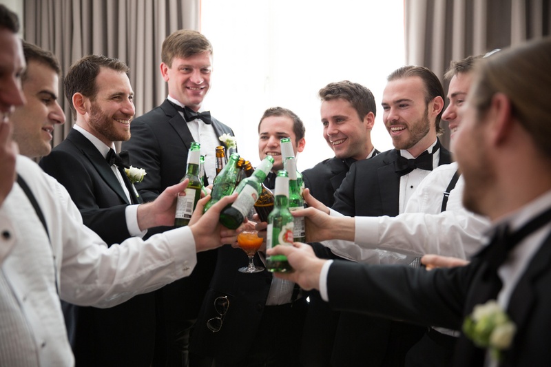 Groom and Groomsmen Cheers with Beer
Photography: Ira Lippke Studios
Read More:
http://www.insideweddings.com/weddings/chic-classic-new-york-city-wedding-with-personal-touches/783/ a groom and his groomsmen clad in black tuxedos toast to his upcoming marriage