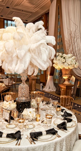 Voluminous White Feather Centerpiece
Photography: KingenSmith
Read More:
http://www.insideweddings.com/weddings/elegant-vintage-inspired-destination-wedding-in-chicago/920/ Glam vintage inspired wedding reception white linen black bow napkin white feather tall centerpiece