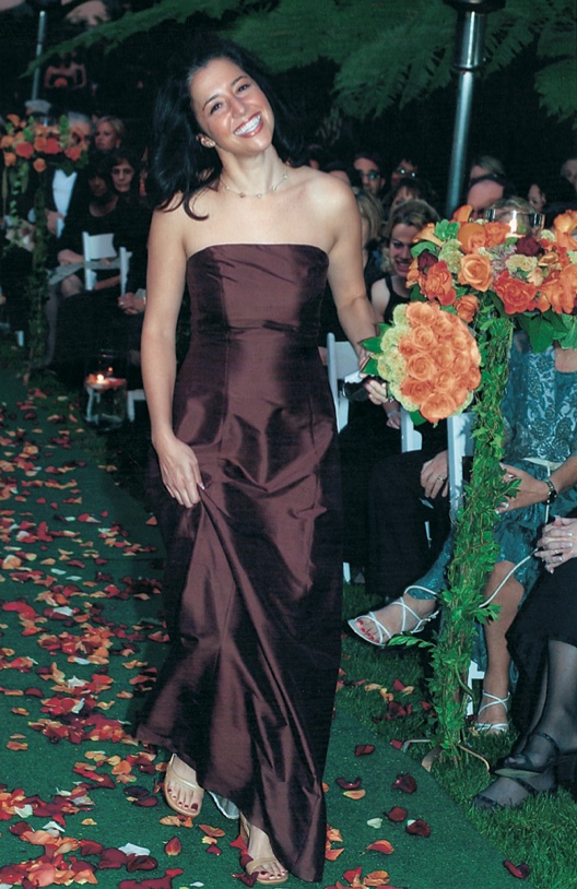 Bridesmaid Walks Down Aisle
Photography: Simone %26 Martin Photography
Read More:
http://www.insideweddings.com/weddings/a-midsummer-nights-dream-wedding-in-beverly-hills-california/58/ bridesmaid wears satin brown dress and carries orange roses bouquet