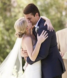 Bride and Groom Ceremony Kiss
Photography: Catherine Hall Studios
Read More:
http://www.insideweddings.com/weddings/rustic-classic-summer-wedding-in-lake-tahoe-california/645/ Couple kissing under umbrella in Lake Tahoe