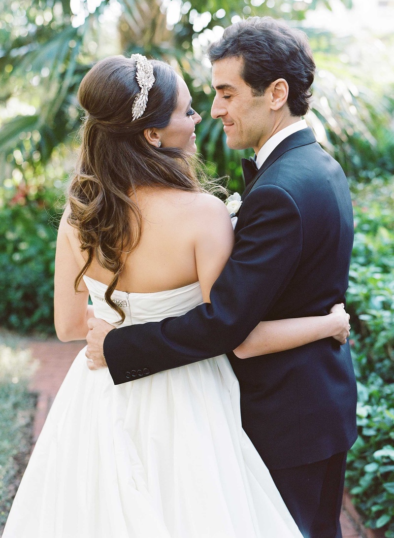 Palm Beach Wedding Couple Photo
Photography: Kat Braman Photography
Read More:
http://www.insideweddings.com/weddings/a-sophisticated-museum-wedding-with-modern-details-in-palm-beach/899/ Bride in strapless Reem Acra a line wedding dress hugs groom with one arm headpiece half up hair