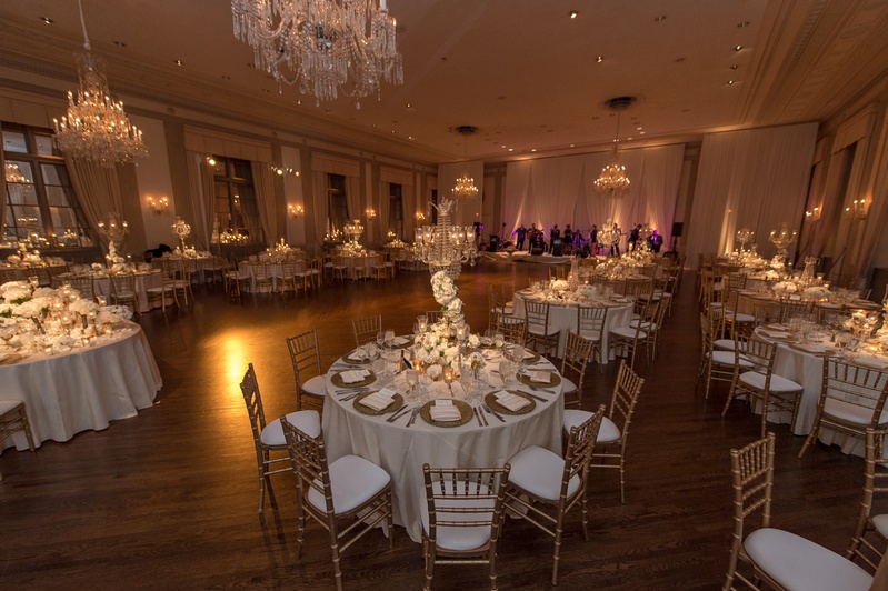 Wide View of Ivory and Gold Reception Space
Photography: Carasco Photography
Read More:
http://www.insideweddings.com/weddings/jewish-wedding-with-classic-ivory-and-gold-decor-in-chicago/983/ standard club chicago wedding, gold chiavari chairs, crystal chandeliers