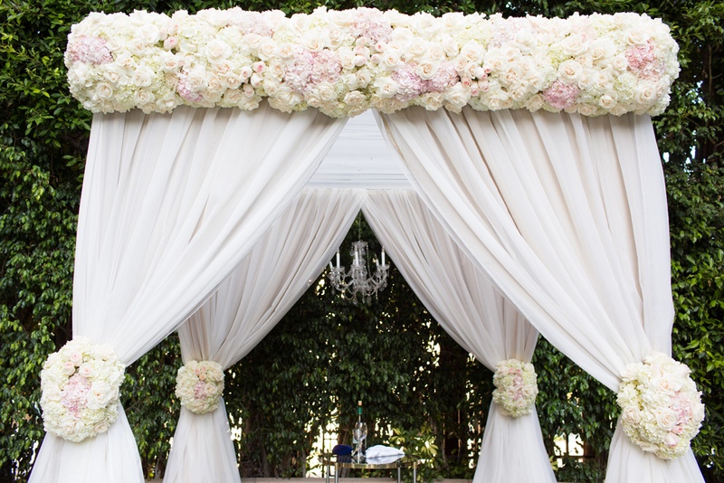 Chuppah with Florals and Drapery
Photography: Duke Photography
Read More:
http://www.insideweddings.com/weddings/jewish-ceremony-classic-ballroom-reception-in-beverly-hills/922/ chuppah with blush and ivory flowers and white drapery