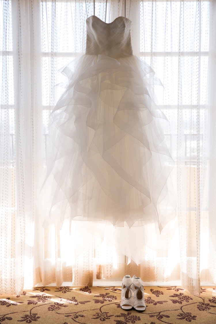 Ruffled Tulle Ball Gown in Window
Photography: Duke Photography
Read More:
http://www.insideweddings.com/weddings/jewish-ceremony-classic-ballroom-reception-in-beverly-hills/922/ reem acra ball gown with a ruffled tulle skirt in window with aquazarra shoes
