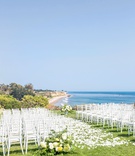 Ocean-View Ceremony in Santa Barbara
Photography: Willa Kveta Photography
Read More:
http://www.insideweddings.com/weddings/destination-wedding-in-santa-barbara-with-california-sunshine-theme/1310/ wedding ceremony on grass bluff overlooking pacific ocean beach white chair yellow flowers sunny