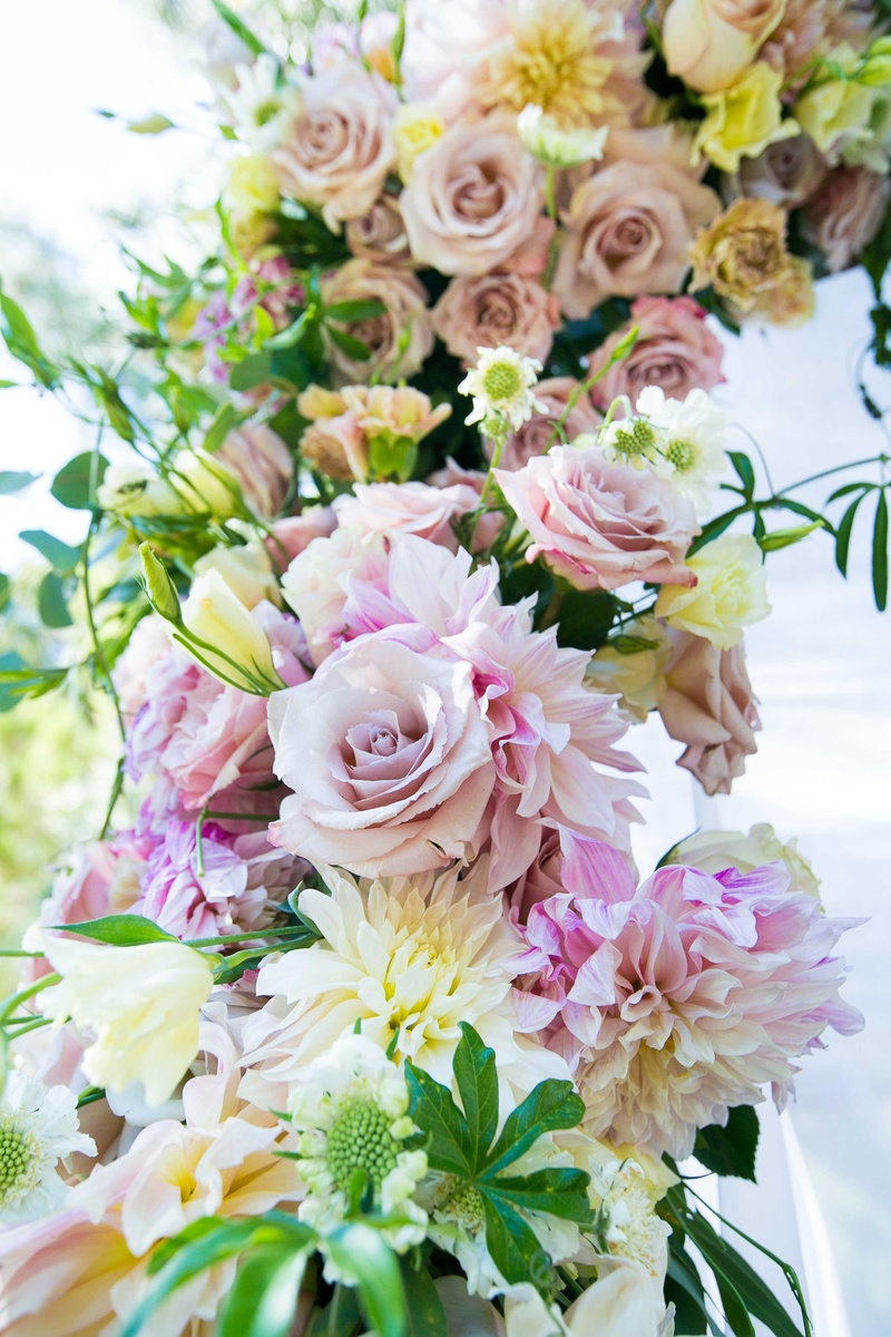 Bright Flowers and Foliage on Chuppah
Photography: Callaway Gable
Read More:
http://www.insideweddings.com/weddings/alfresco-summer-wedding-with-lush-foliage-accents-in-california/805/ flowers in shades of blush, ivory, and off-white with greenery clinging to couples outdoor chuppah