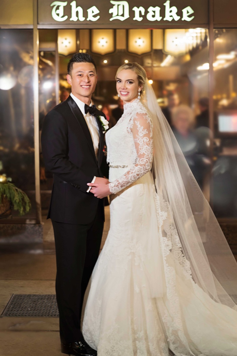 Bride and Groom Outside The Drake Venue
Photography: Carasco Photography
Read More:
http://www.insideweddings.com/weddings/new-york-yankees-infielder-marries-in-opulent-chicago-soiree/764/ rob refsnyder of new york yankees and bride in matthew christopher gown outside the drake hotel