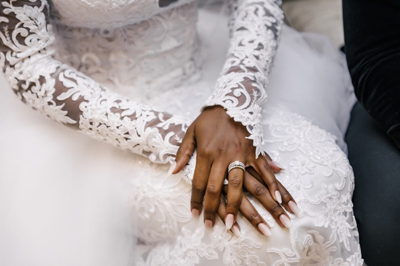 Bride with Diamond Ring Stack
Photography: Amy Anaiz Photography
Read More:
http://www.insideweddings.com/weddings/modern-elegant-wedding-with-warm-inviting-white-gold-decor/1370/ african american bride luxury wedding long sleeve wedding dress sheer illusion details embroidery