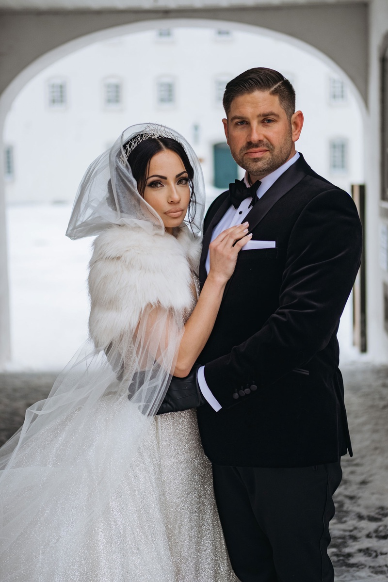 Winter Wedding Couple in Quebec
Photography: Joel %26 Justyna
Read More:
http://www.insideweddings.com/weddings/dreamy-winter-destination-wedding-in-an-ice-castle-in-quebec-city/1270/ bride in sparkle wedding dress with fur wrap and hood cape groom with black gloves and tuxedo snow